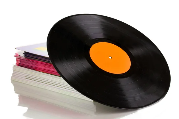 Zwart vinyl record en stack van tijdschriften geïsoleerd op wit — Stockfoto