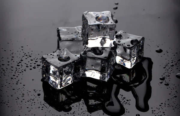 Melting ice cubes on grey background — Stock Photo, Image