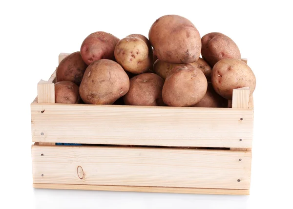 Raw potatoes in a wooden box isolated on white — Stock Photo, Image