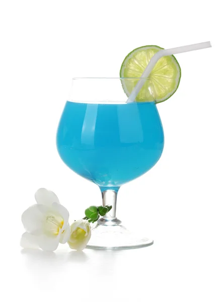 Glass of blue cocktail with lime and flowers isolated on white — Stock Photo, Image