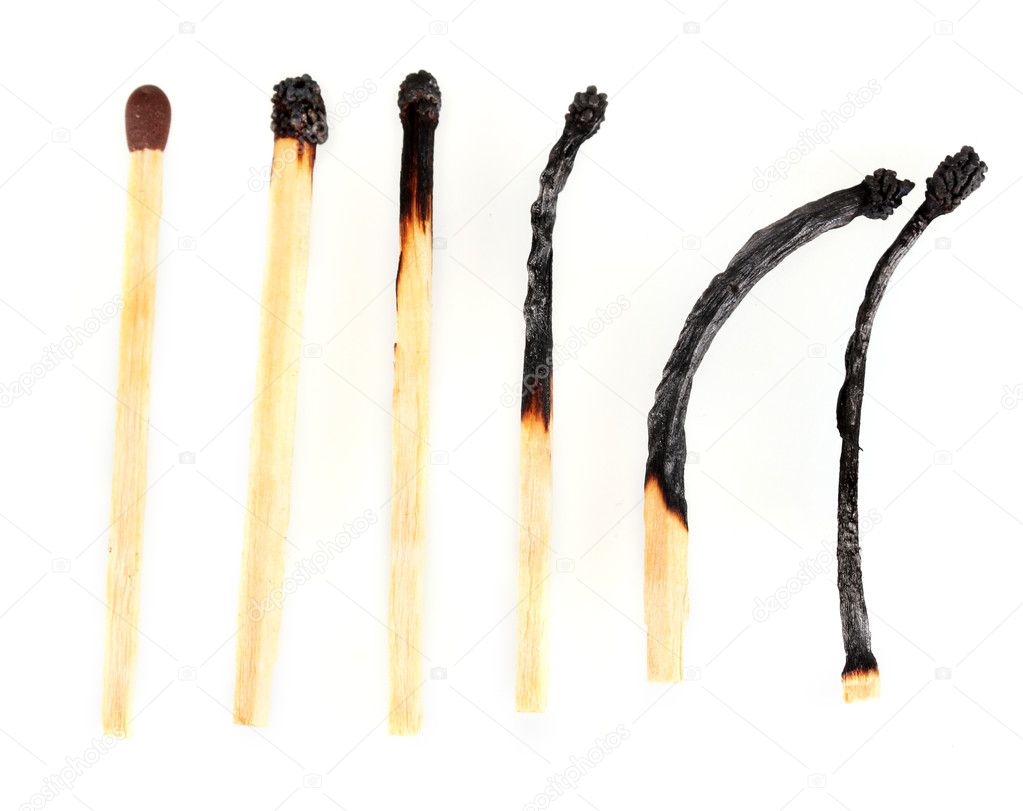 Burnt matches and one whole match isolated on white