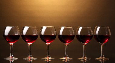 Wineglasses on brown background clipart