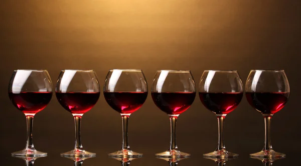 Wineglasses on brown background — Stock Photo, Image