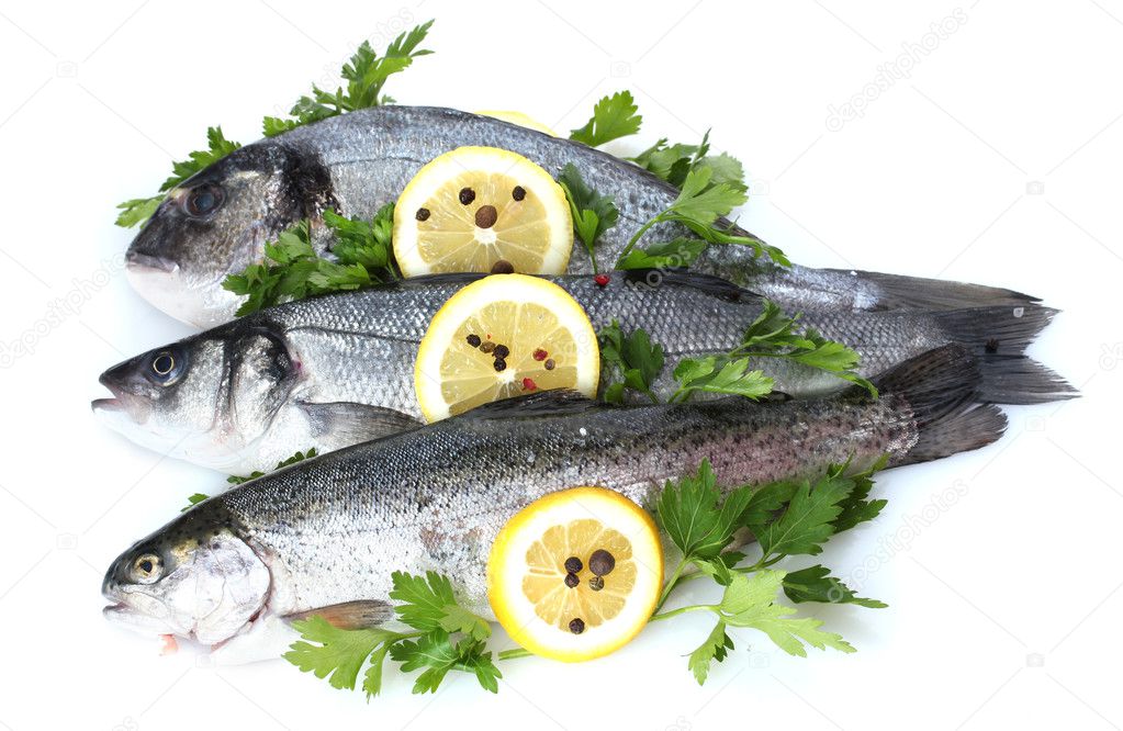 Fresh fishes with lemon, parsley and spice isolated on white