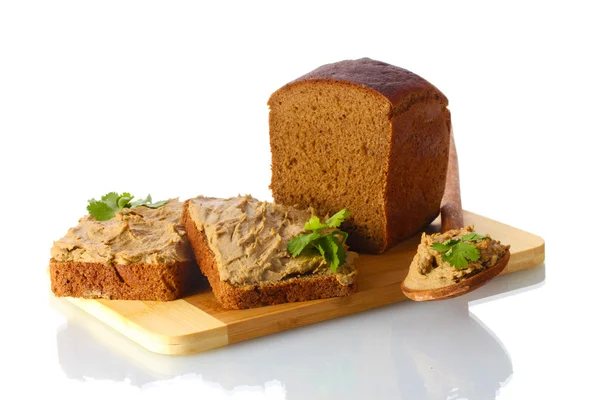 Fresh pate on bread on wooden board isolated on white — Stock Photo, Image