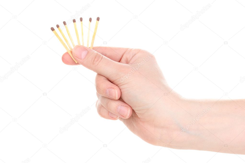 Matches in hand isolated on white