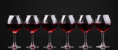 Wineglasses isolated on black clipart