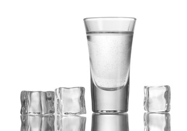 Glass of vodka with ice isolaled on white clipart