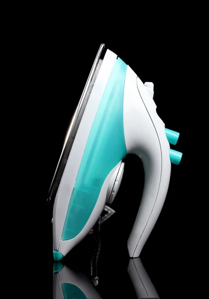 stock image Electric iron on black