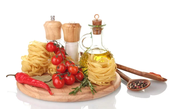 Noodles, jar of oil, spices and vegetables on wooden board isolated on white — Stock Photo, Image