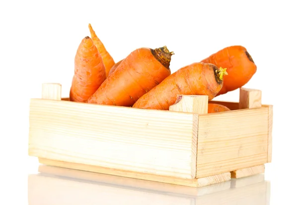 Raw carrots in wooden box isolated on white — Stock Photo, Image