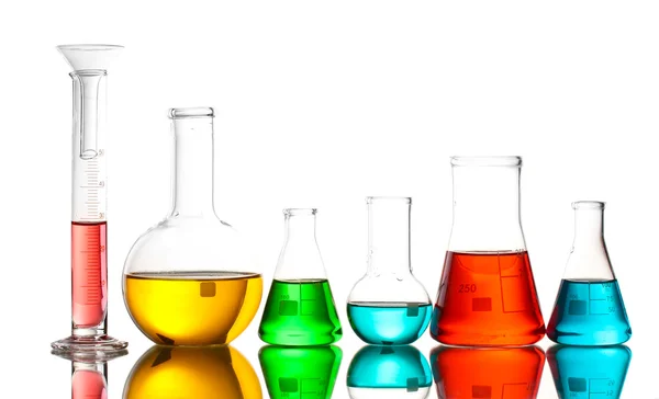 Different laboratory glassware with color liquid and with reflection isolated on white — Stock Photo, Image