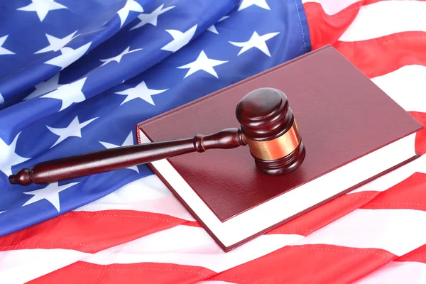 stock image Judge gavel and book on american flag background