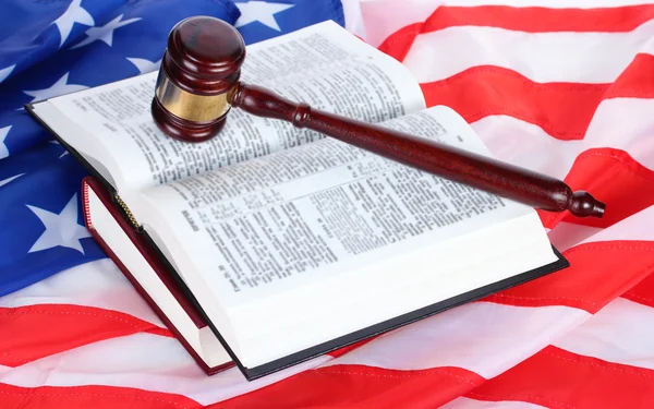 stock image Judge gavel and books on american flag background