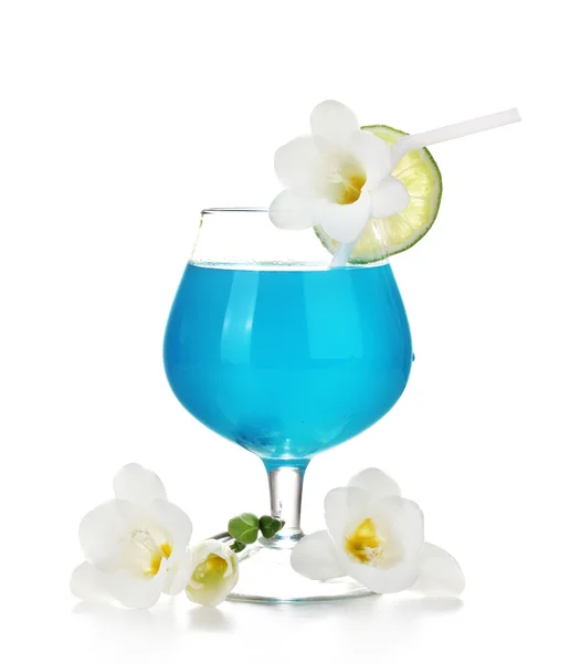 Glass of blue cocktail with lime and flowers isolated on white — Stock Photo, Image
