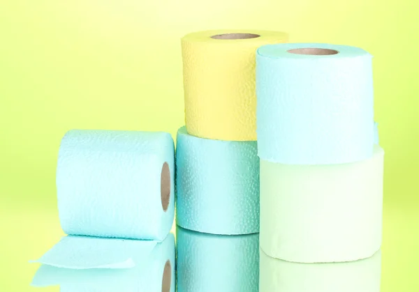 Bright rolls of toilet paper on green background — Stock Photo, Image