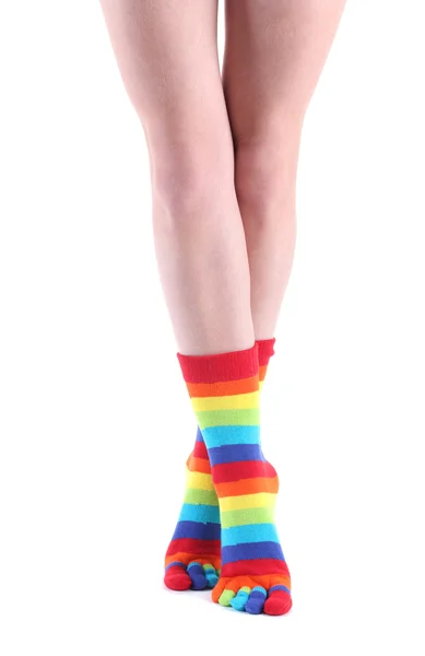Female legs in colorful striped socks isolated on white — Stock Photo, Image