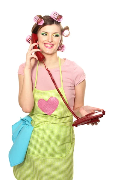 Schöne junge Hausfrau mit rotem Telefon isoliert auf weißem — Stockfoto