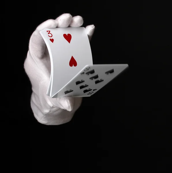 Cartões na mão isolados em preto — Fotografia de Stock
