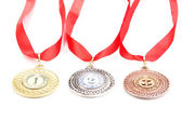 tři medaile izolovaných na bílém