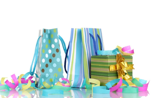 Colorful gift bags and gifts with serpentine isolated on white — Stock Photo, Image