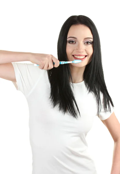 Bela jovem segurando escova de dentes isolada no branco — Fotografia de Stock