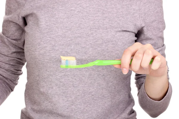 Tandenborstel met plakken in de hand geïsoleerd op wit — Stockfoto