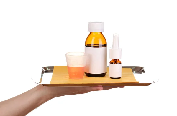 Hand holding tray with medicines isolated on white — Stock Photo, Image
