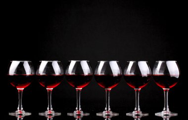 Wineglasses isolated on black clipart