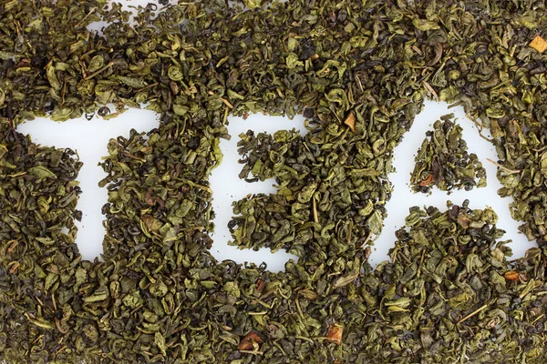 Word tea made of dry leaves closeup — Stock Photo, Image