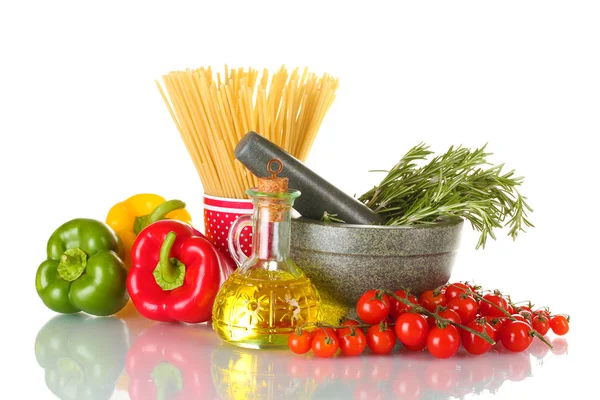 Spaghetti in cup, rosemary in mortar, oil in jar paprika, tomatoes cherry, and onion isolated on white — Stock Photo, Image