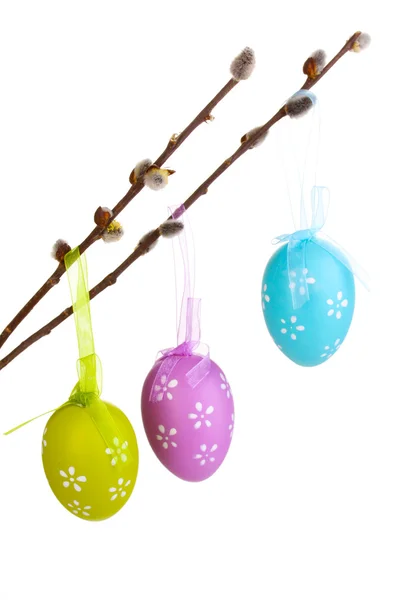 Colorful easter eggs hanging on ribbons isolated on white — Stock Photo, Image