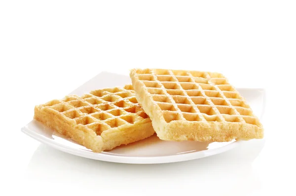 Waffles doces na placa isolada em branco — Fotografia de Stock