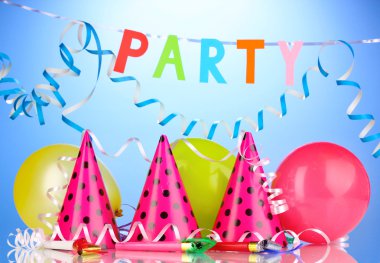 Party items on blue background clipart