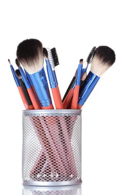 Make-up brushes in holder isolated on white