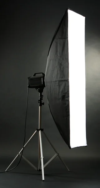 Studio flash with soft-box on black studio background — Stock Photo, Image