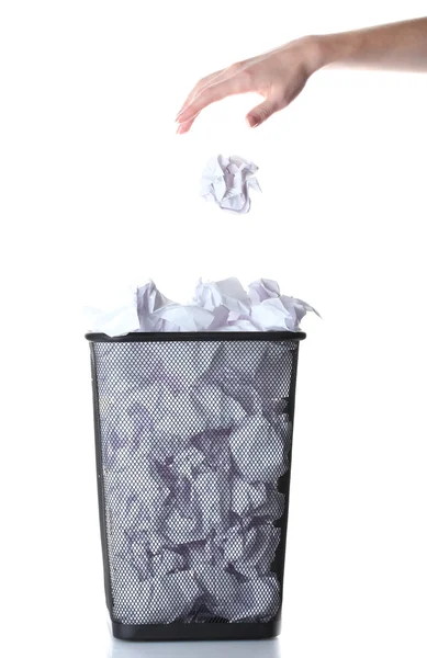 Hand going garbage in metal trash bin from paper isolated on white — Stock Photo, Image