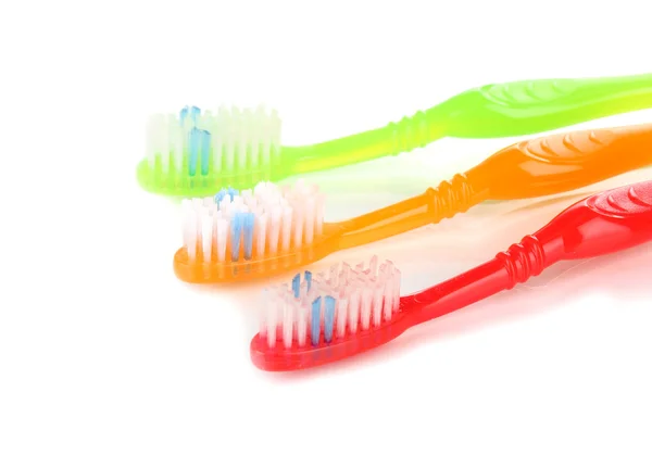 Escovas de dentes isoladas em branco — Fotografia de Stock