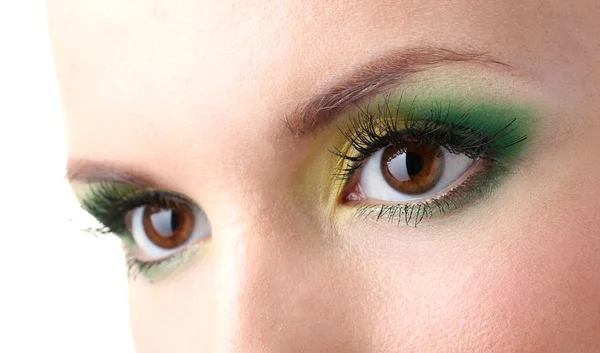Schöne weibliche Augen mit hellem Make-up lizenzfreie Stockfotos