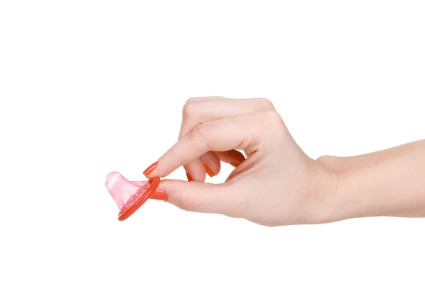 Mano sosteniendo un condón aislado en blanco —  Fotos de Stock