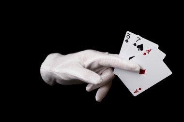 Cards in hand isolated on black clipart