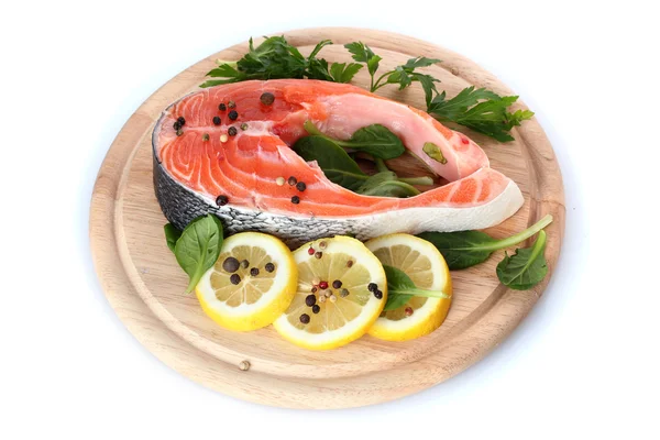 Red fish with lemon and parsley on wooden cutting board isolated on white — Stock Photo, Image