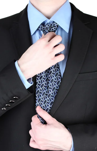 Affärsman korrigera en slips på nära håll — Stockfoto