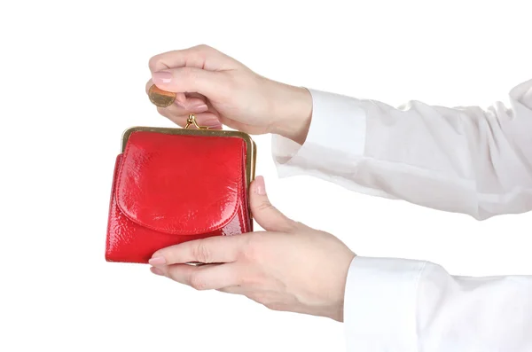 Donna mano gettando moneta in borsa isolato su bianco — Foto Stock