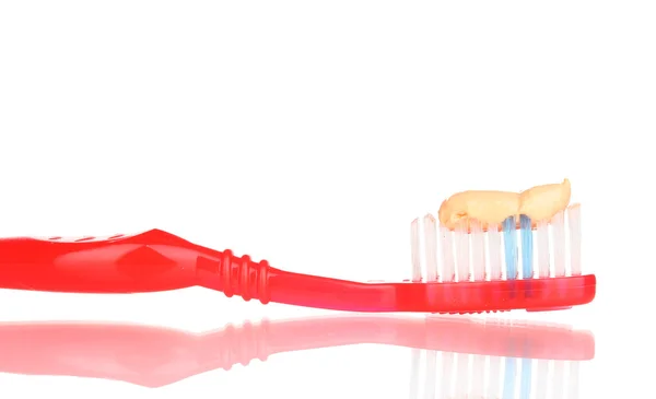 Tandenborstel met plakken geïsoleerd op wit — Stockfoto
