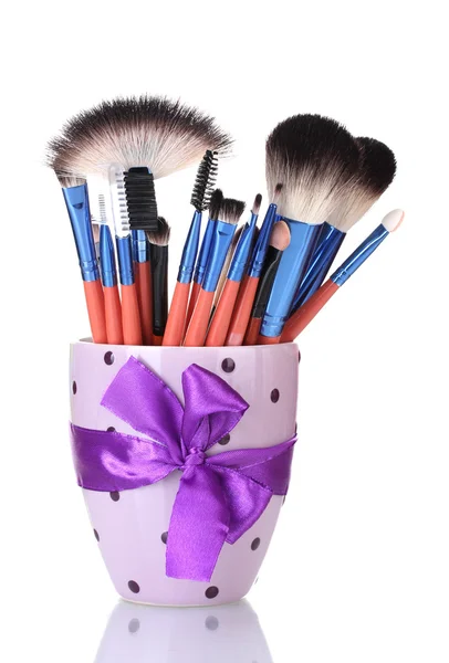 Make-up brushes in cup isolated on white — Stock Photo, Image