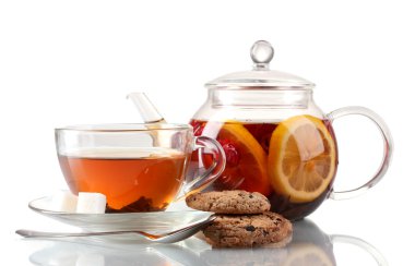 Black fruit tea in glass teaopot and cup isolated on white clipart