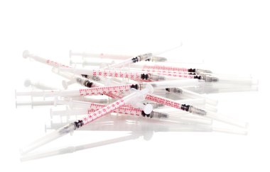 Insulin syringes isolated on white clipart