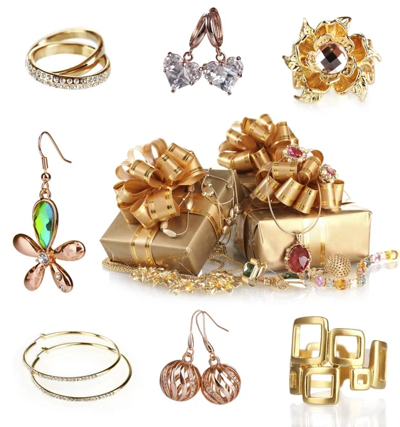 Bella collezione di gioielli in oro isolato su bianco — Foto Stock