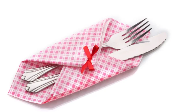 Fork and knife in a plaid cloth with a bow isolated on white — Stock Photo, Image